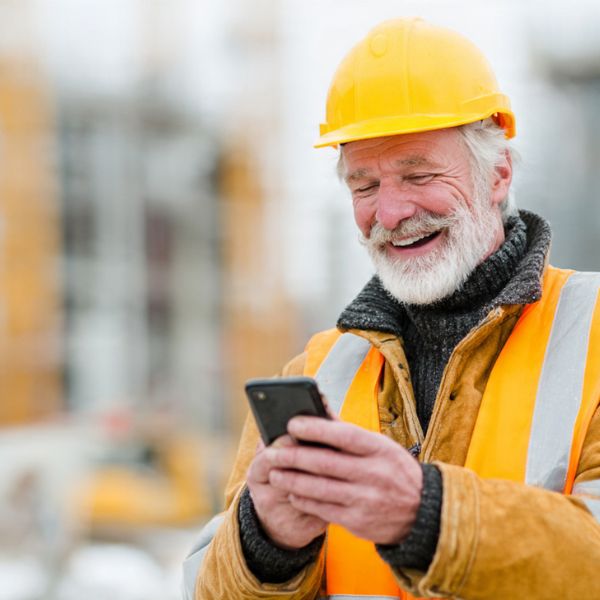 Precision estimator reviewing blueprints and localized cost numbers